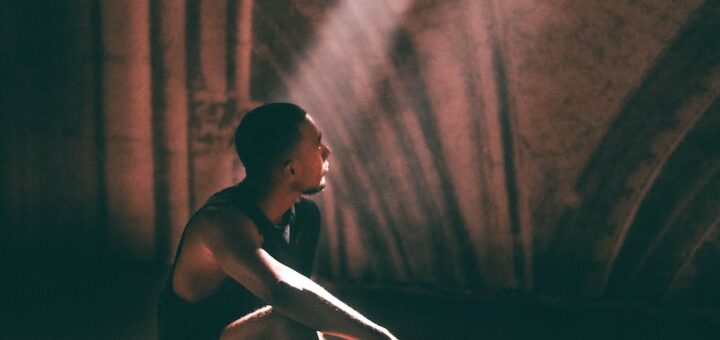 man sitting on stage